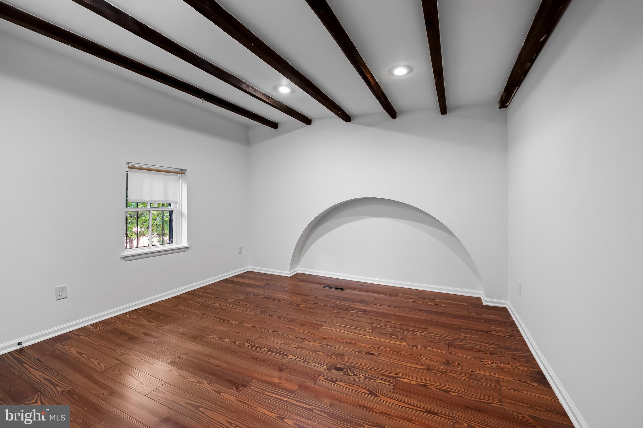 307 Mosher Street Baltimore, MD 21217 - Photo 27 of 30 a view of empty room with wooden floor