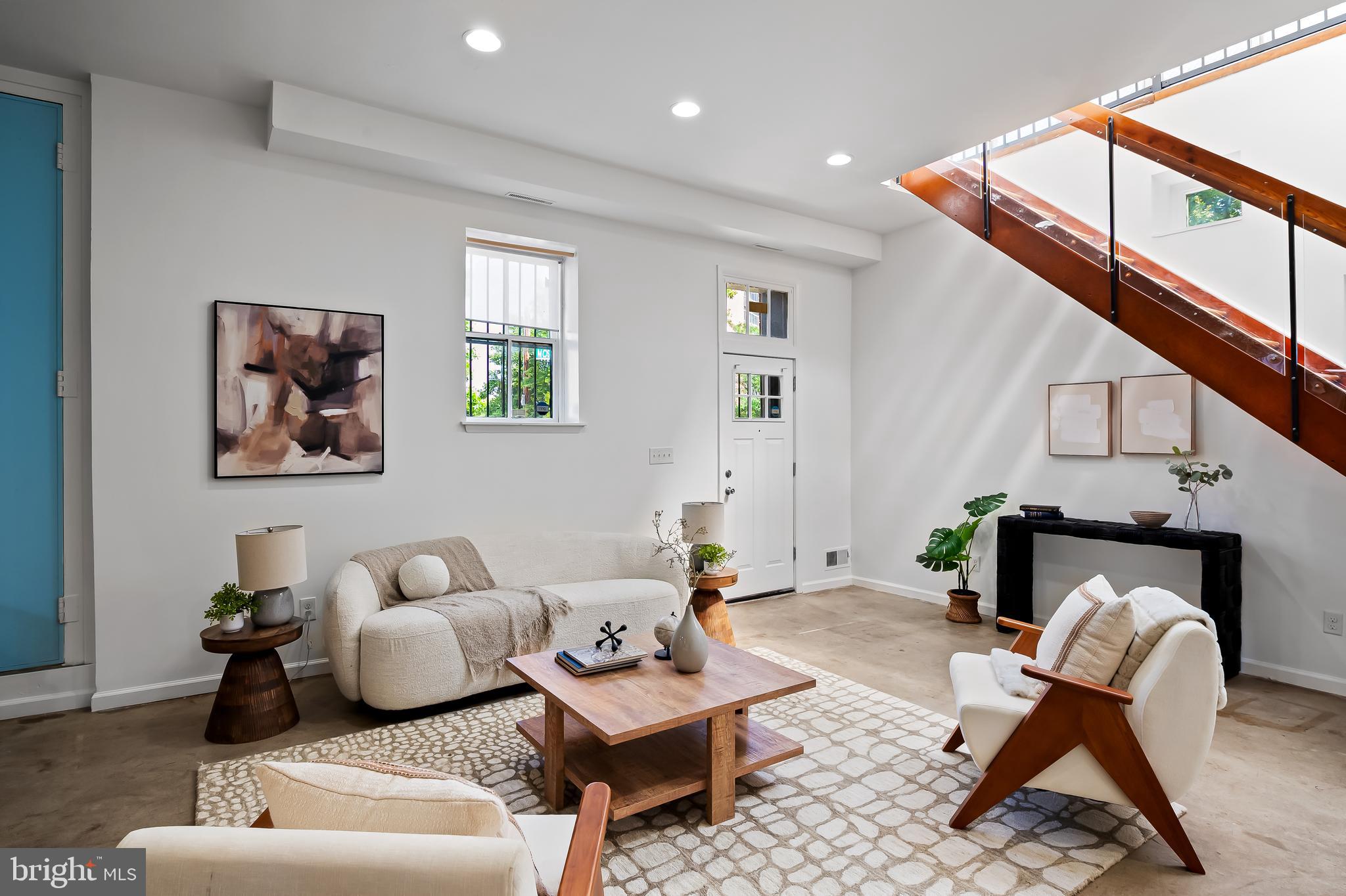 307 Mosher Street Baltimore, MD 21217 - Photo 5 of 30 a living room with furniture a rug and a window