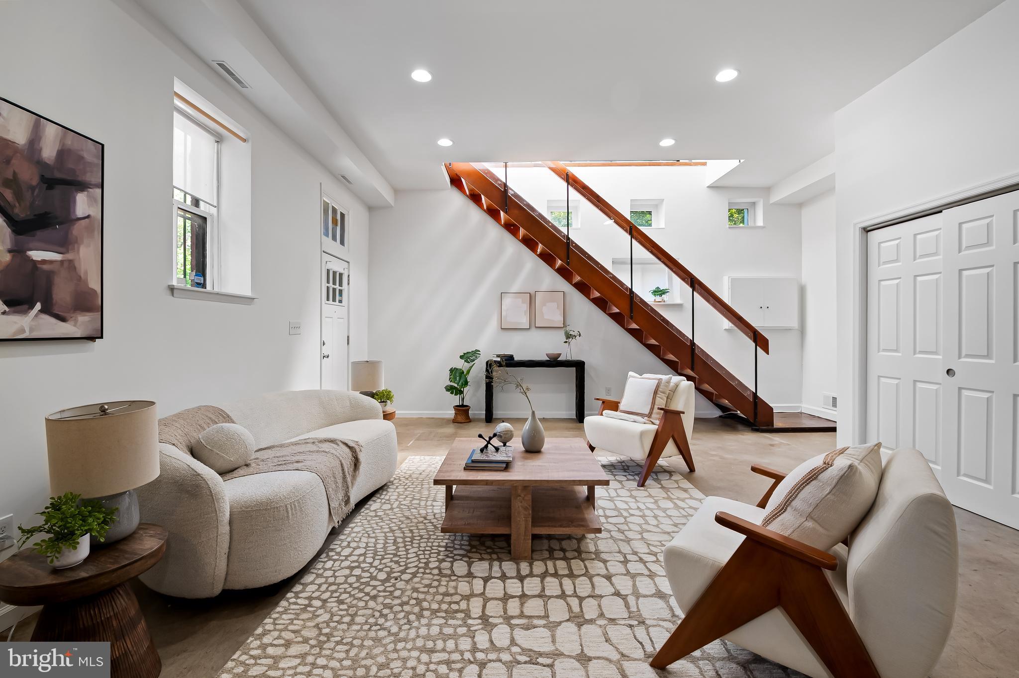 307 Mosher Street Baltimore, MD 21217 - Photo 6 of 30 a living room with furniture and a wooden floor