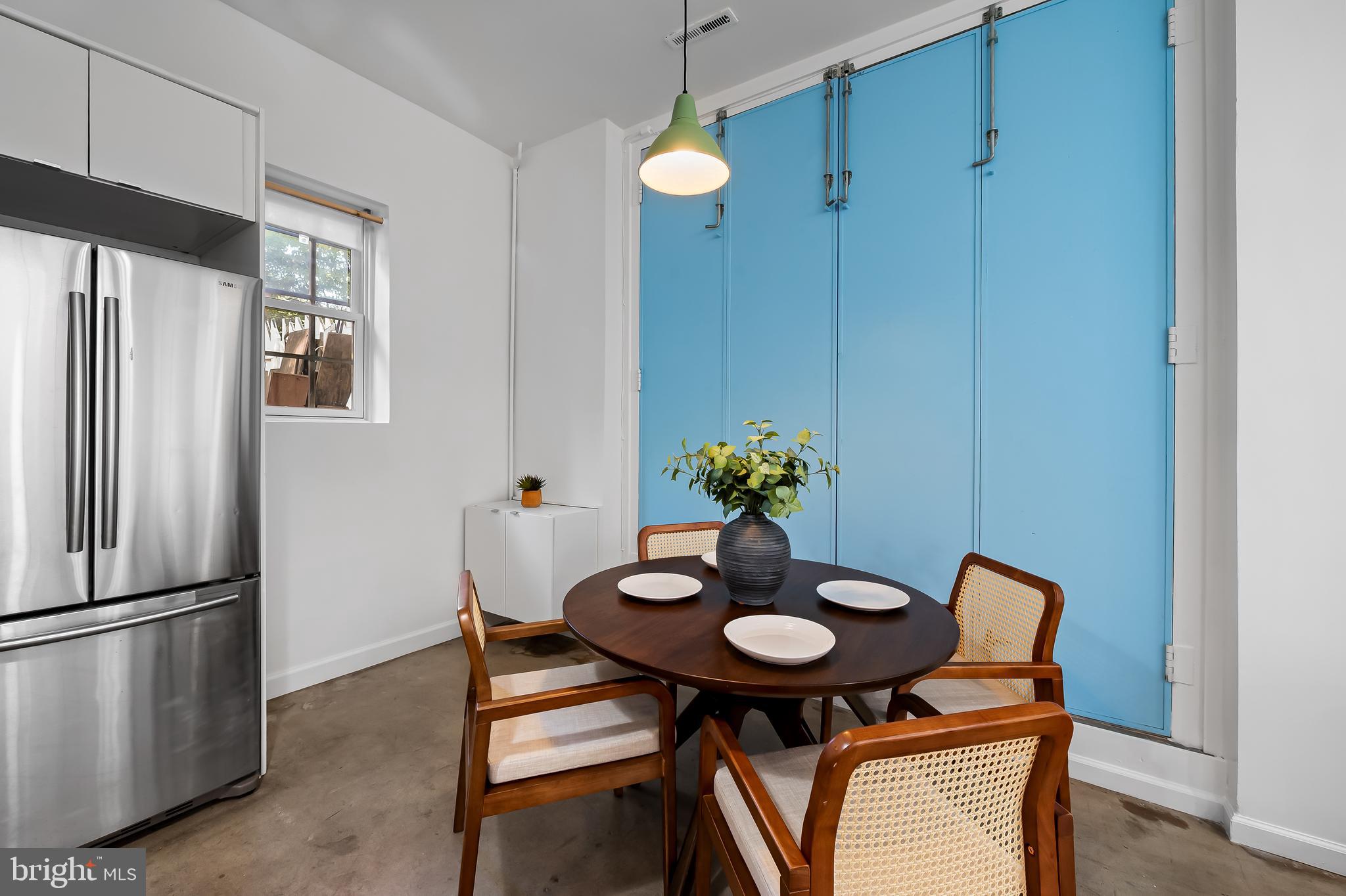 307 Mosher Street Baltimore, MD 21217 - Photo 10 of 30 a table and chairs in a kitchen