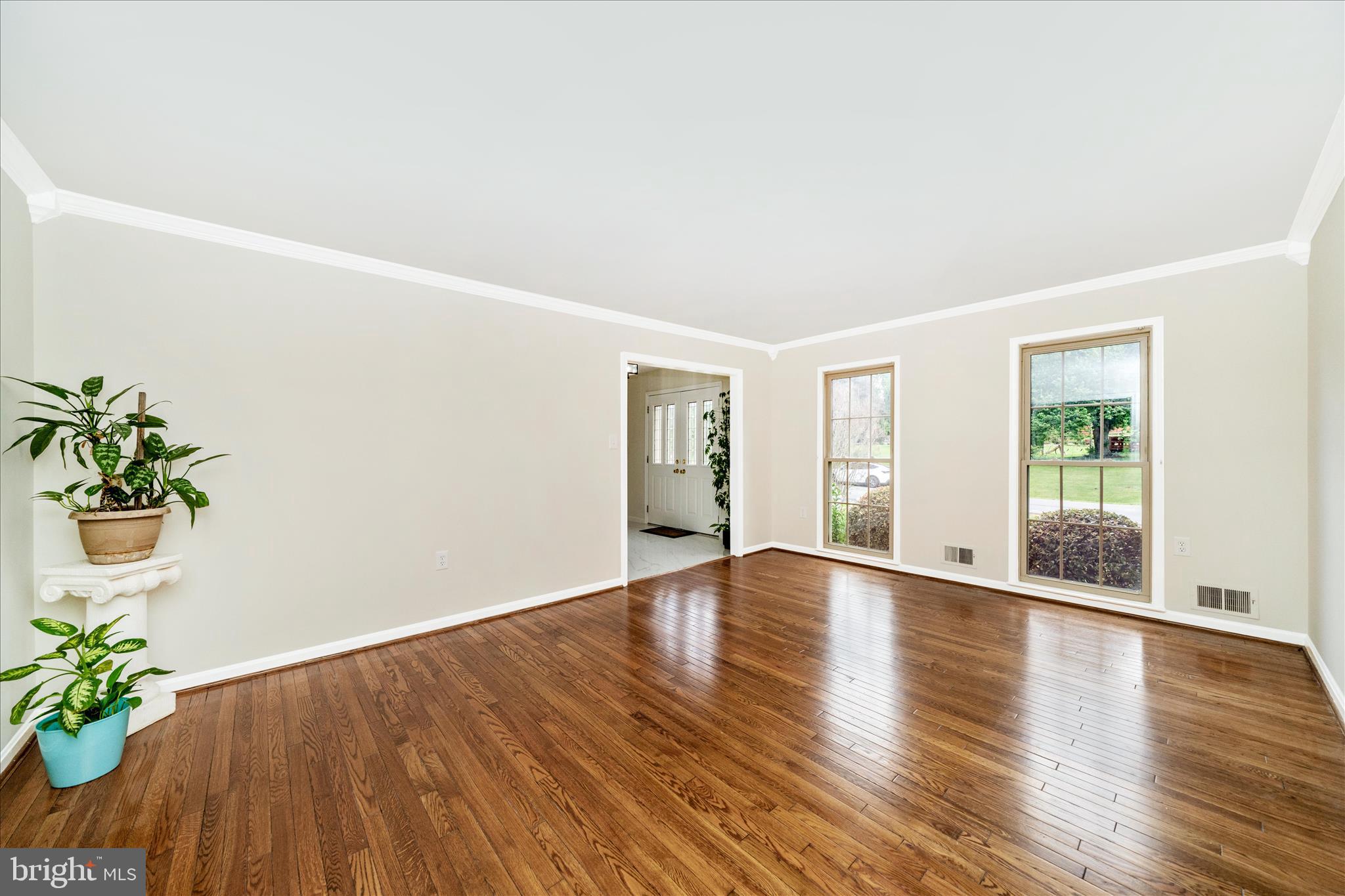 16000 Narrows Terrace Silver Spring, MD 20906 - Photo 8 of 54 a view of an empty room with wooden floor and a window