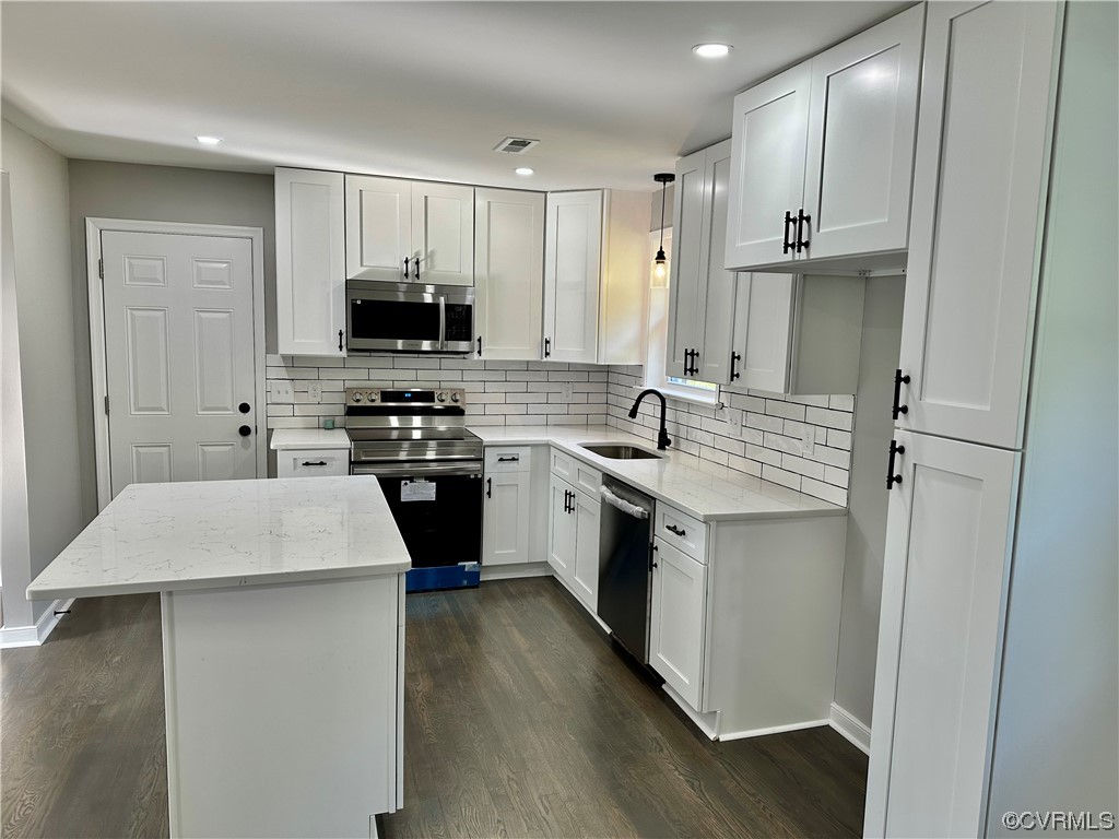 1035 Southam Drive Richmond, VA 23235 - Photo 12 of 43 a kitchen with a sink stove and refrigerator