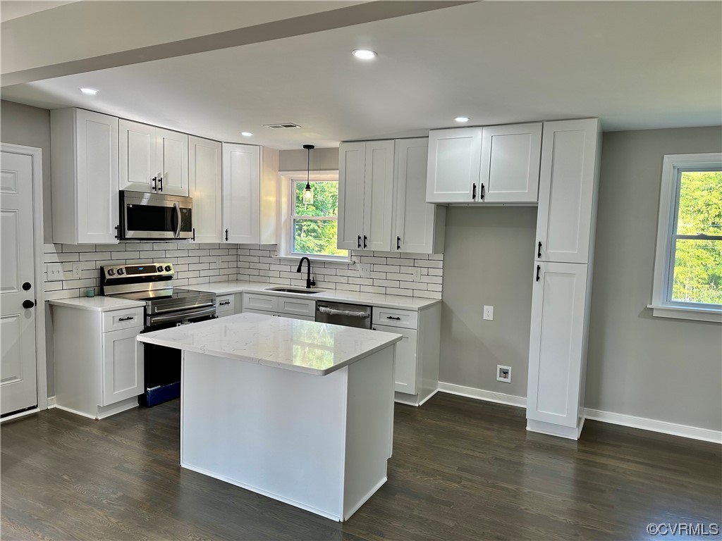 1035 Southam Drive Richmond, VA 23235 - Photo 13 of 43 a kitchen with stainless steel appliances granite countertop a sink stove and refrigerator