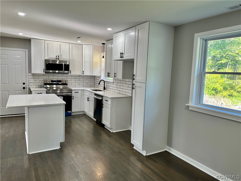 1035 Southam Drive Richmond, VA 23235 - Photo 15 of 43 a kitchen with a sink cabinets and wooden floor