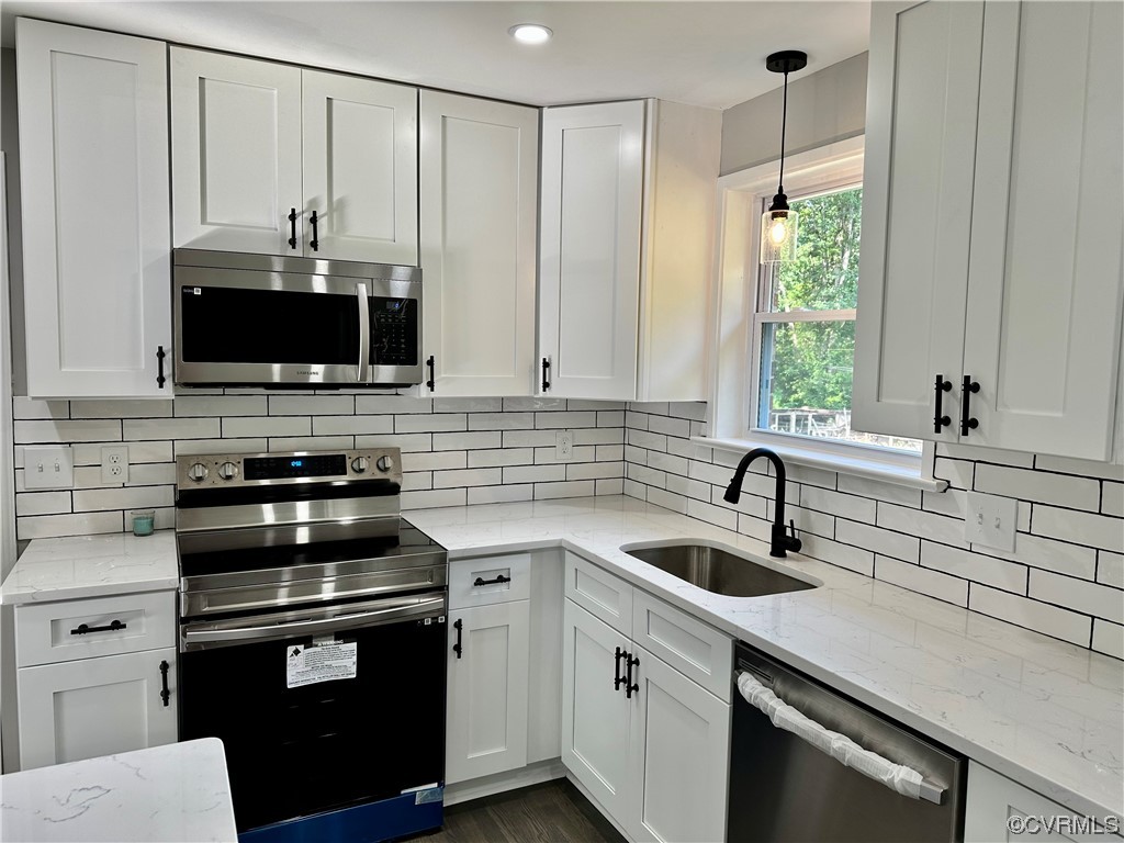 1035 Southam Drive Richmond, VA 23235 - Photo 16 of 43 a kitchen with a sink appliances and cabinets