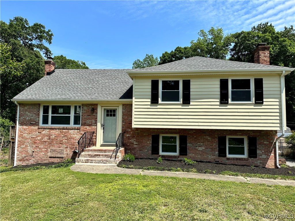 1035 Southam Drive Richmond, VA 23235 - Photo 2 of 43 a front view of a house with a yard