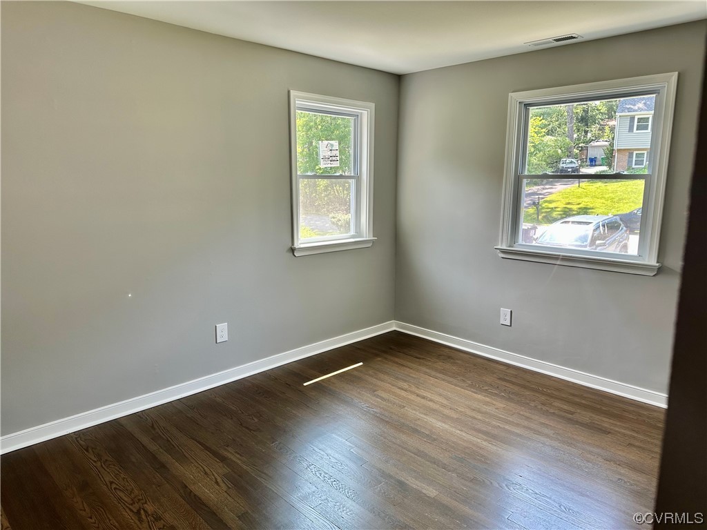 1035 Southam Drive Richmond, VA 23235 - Photo 21 of 43 a view of an empty room with wooden floor and a window