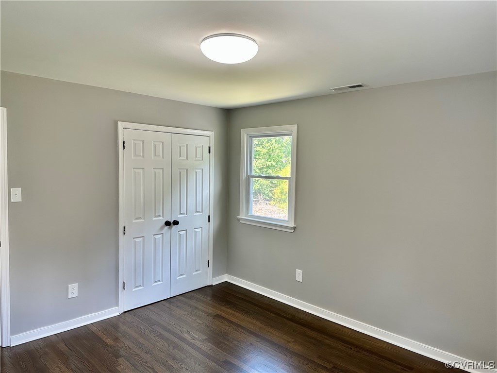 1035 Southam Drive Richmond, VA 23235 - Photo 22 of 43 an empty room with wooden floor and windows