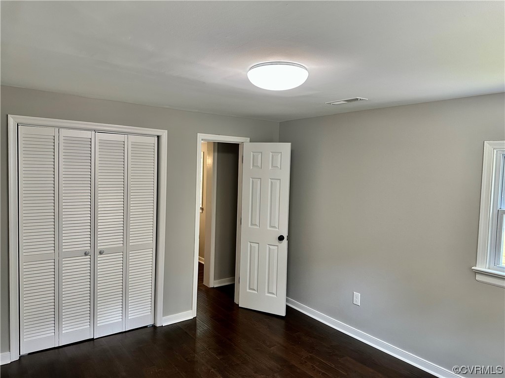 1035 Southam Drive Richmond, VA 23235 - Photo 32 of 43 an empty room with wooden floor and windows