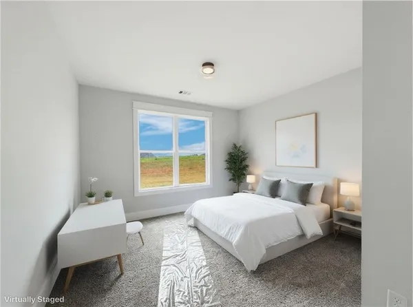 a kitchen with stainless steel appliances a stove a white cabinet and a granite counter tops