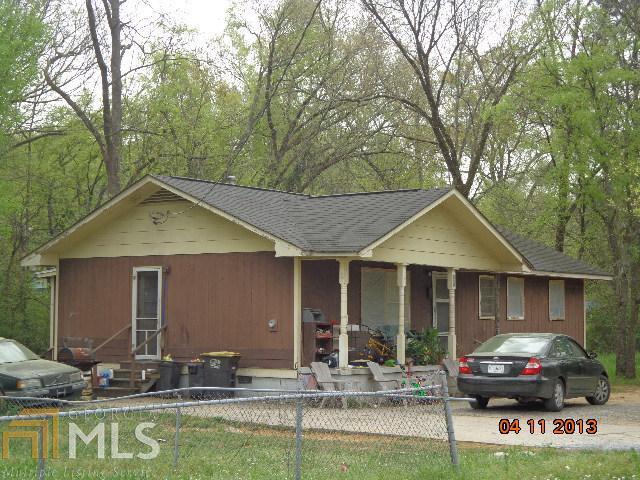 213 Branham Avenue Southwest Rome, GA 30161 - Photo 1 of 1 a front view of house with yard outdoor seating and barbeque oven