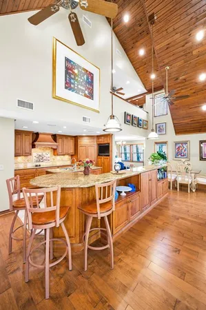 a kitchen with stainless steel appliances granite countertop a sink and cabinets