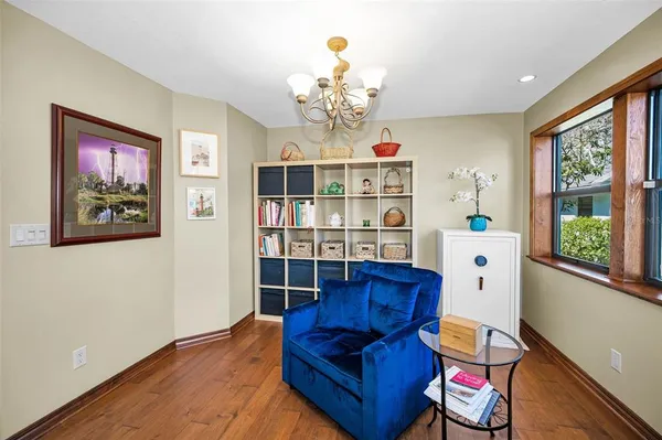 a view of workspace with wooden floor windows