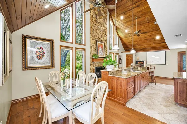 a bedroom with a bed and a ceiling fan