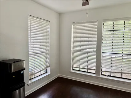a kitchen with stainless steel appliances granite countertop a refrigerator a stove and a sink