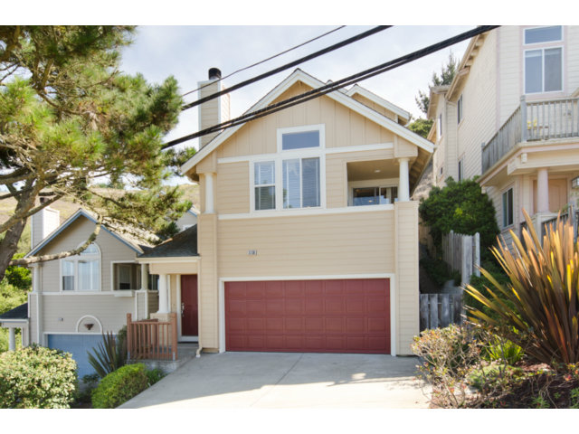 513 Monterey Road, Unit B Pacifica, CA 94044 - Photo 1 of 23 a front view of a house with a garden