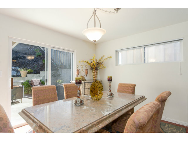 513 Monterey Road, Unit B Pacifica, CA 94044 - Photo 11 of 23 a view of a dining room with furniture and wooden floor