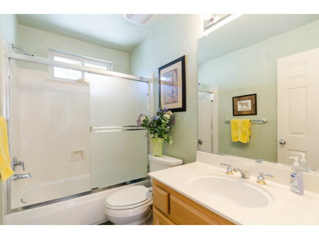 513 Monterey Road, Unit B Pacifica, CA 94044 - Photo 15 of 23 a bathroom with a sink a toilet and shower