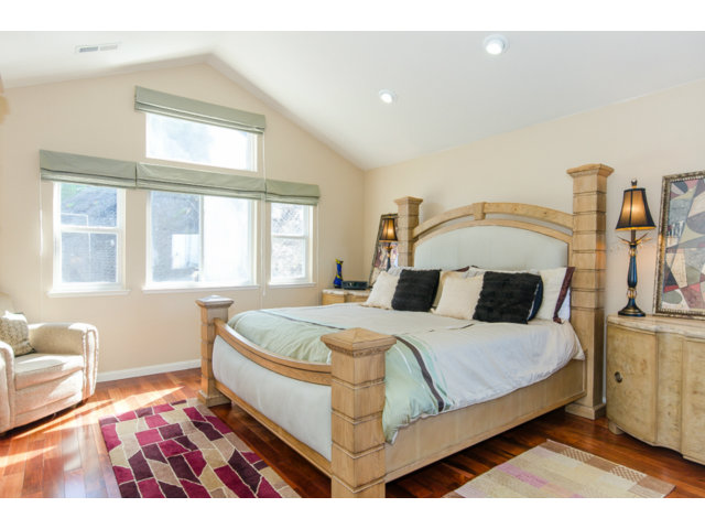 513 Monterey Road, Unit B Pacifica, CA 94044 - Photo 17 of 23 a bed sitting in a bedroom next to a window