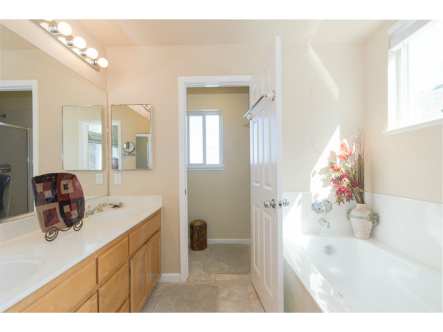 513 Monterey Road, Unit B Pacifica, CA 94044 - Photo 20 of 23 a bathroom with a sink mirror and vanity