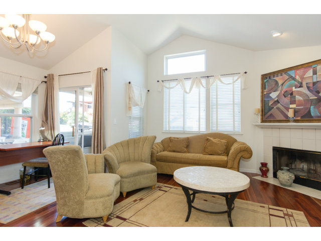 513 Monterey Road, Unit B Pacifica, CA 94044 - Photo 4 of 23 a living room with furniture a fireplace and a large window