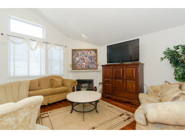 513 Monterey Road, Unit B Pacifica, CA 94044 - Photo 5 of 23 a living room with furniture and a flat screen tv