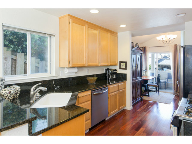 513 Monterey Road, Unit B Pacifica, CA 94044 - Photo 7 of 23 a kitchen with a sink a counter top space and stainless steel appliances