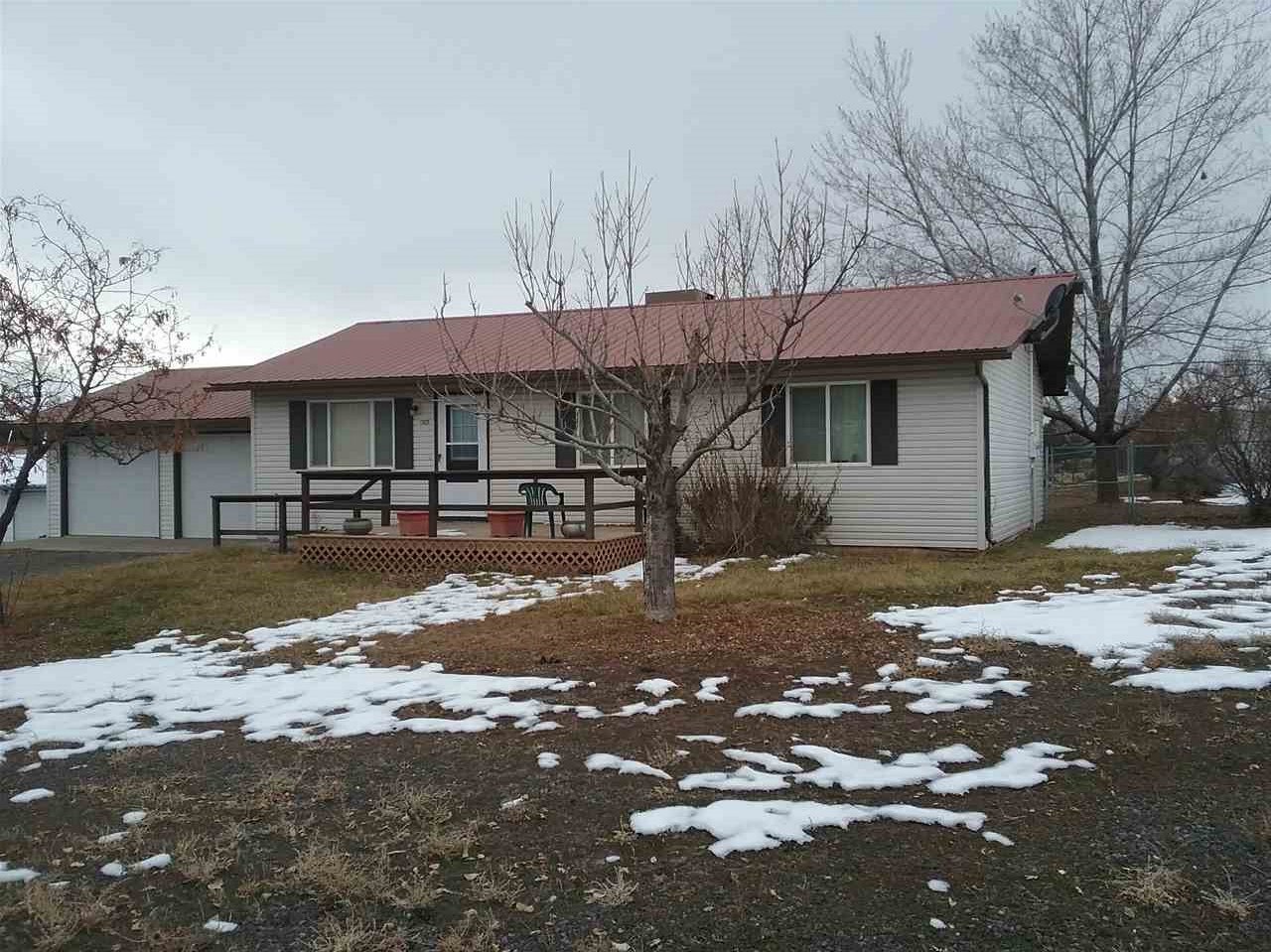 17825 Surface Creek Road Cedaredge, CO 81413 - Photo 24 of 24 a front view of a house with a yard