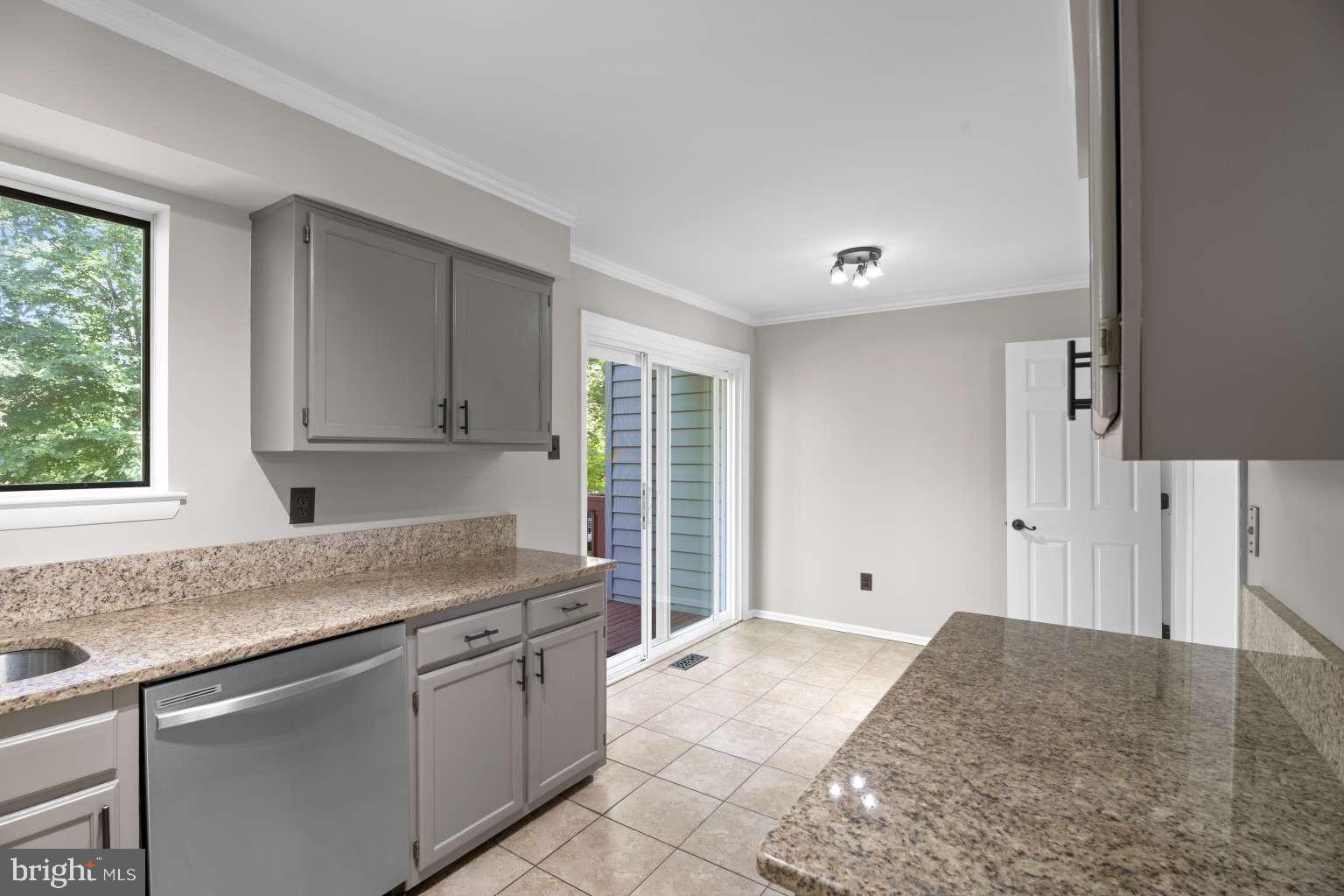 32 Millbridge Court Nottingham, MD 21236 - Photo 12 of 39 a kitchen with granite countertop a sink and a stove
