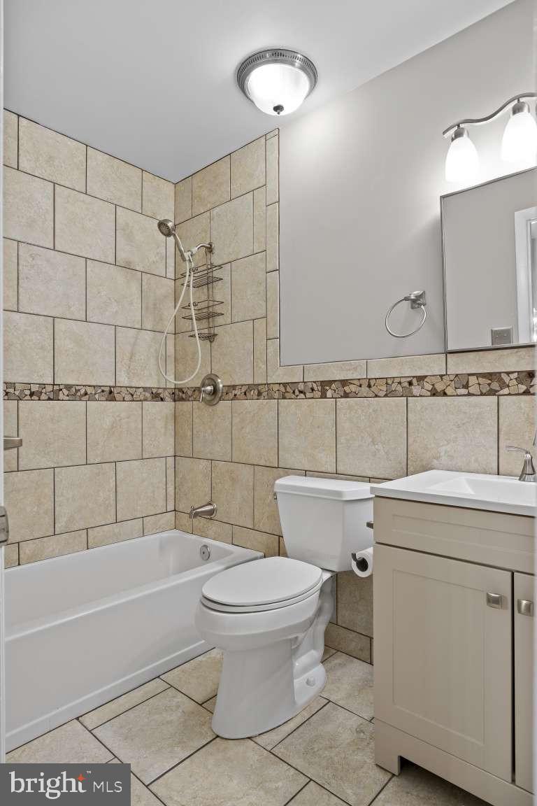 32 Millbridge Court Nottingham, MD 21236 - Photo 15 of 39 a bathroom with a sink a toilet and shower