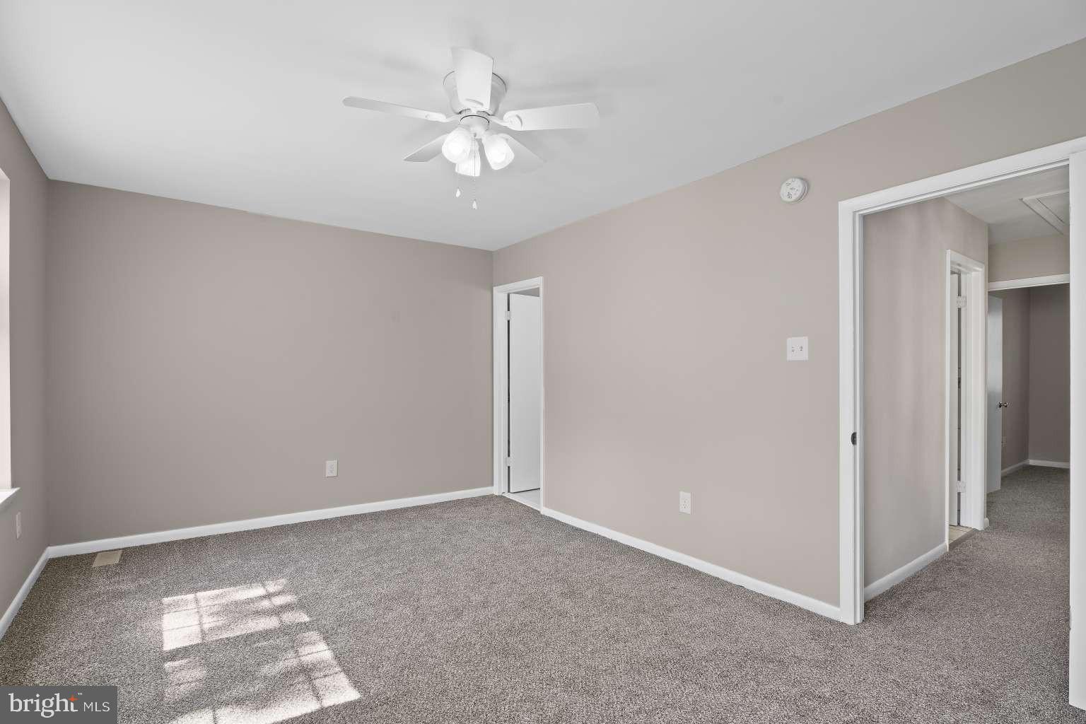 32 Millbridge Court Nottingham, MD 21236 - Photo 18 of 39 a view of an empty room with a chandelier fan