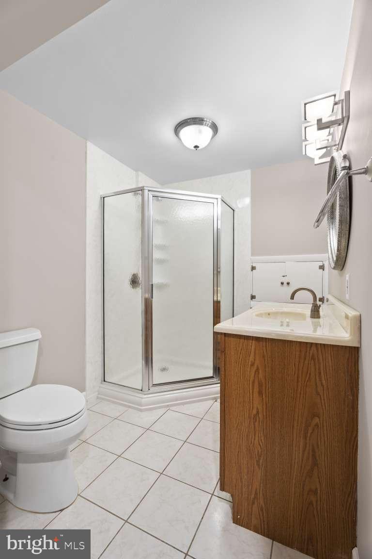 32 Millbridge Court Nottingham, MD 21236 - Photo 28 of 39 a bathroom with a sink toilet and shower