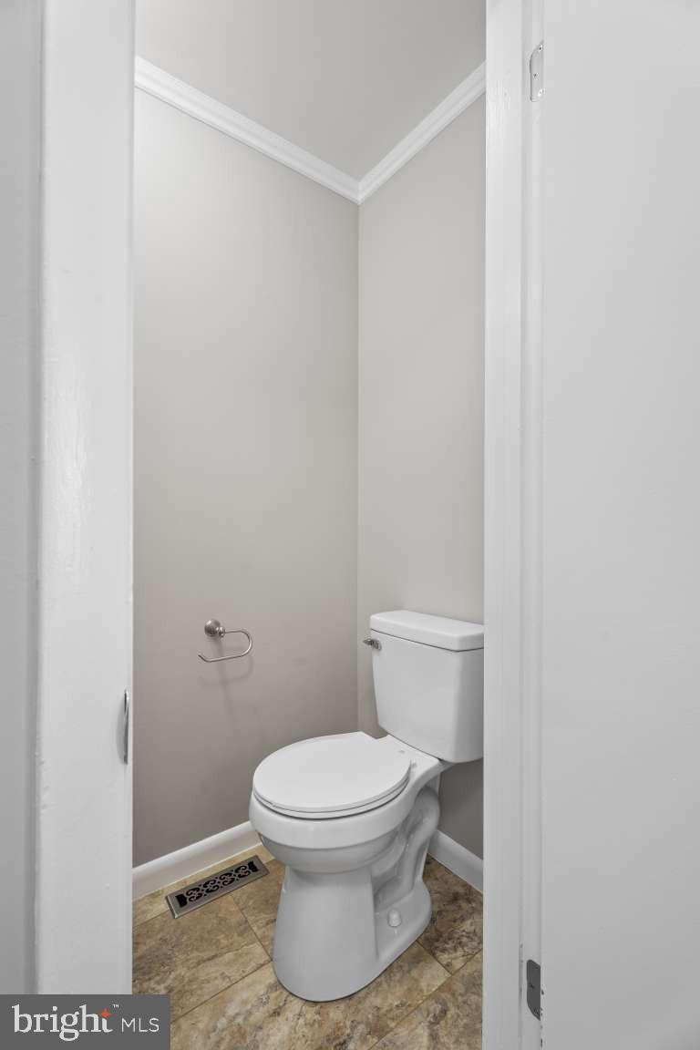 32 Millbridge Court Nottingham, MD 21236 - Photo 9 of 39 a white toilet sitting next to a shower