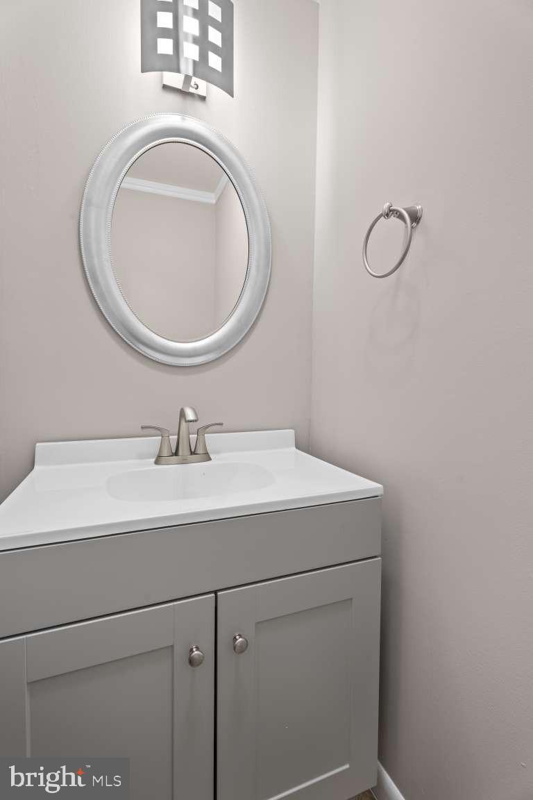 32 Millbridge Court Nottingham, MD 21236 - Photo 10 of 39 a bathroom with a sink and a mirror