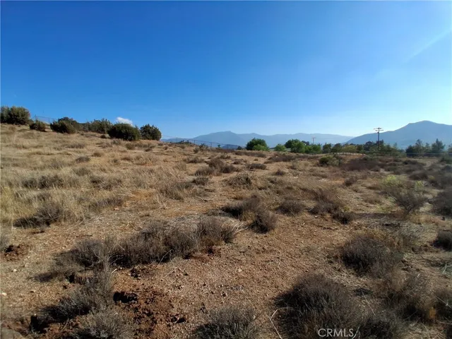 a view of a large building with a view of mountains in the background