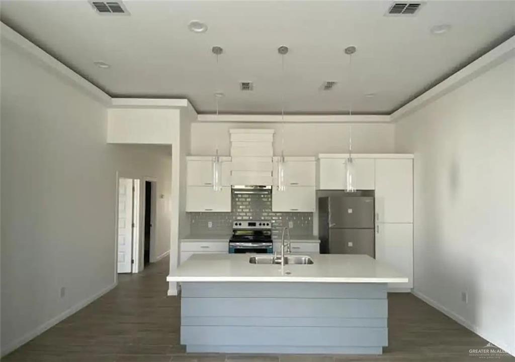1002 North Glasscock Road, Unit 6 Mission, TX 78572 - Photo 2 of 13 a view of kitchen with refrigerator and window
