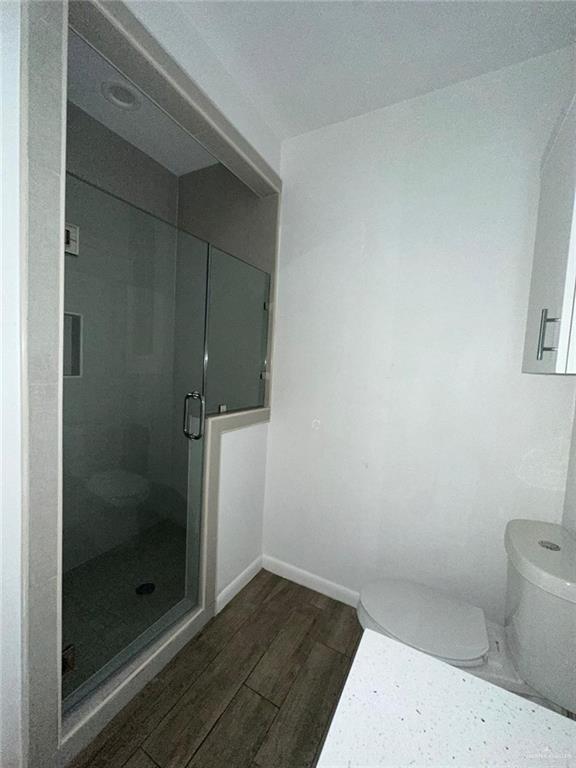 1002 North Glasscock Road, Unit 6 Mission, TX 78572 - Photo 9 of 13 a bathroom with a shower and toilet