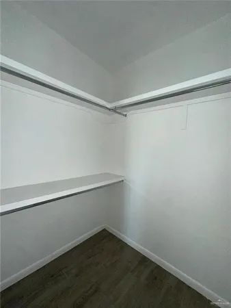 a view of an empty walk in closet