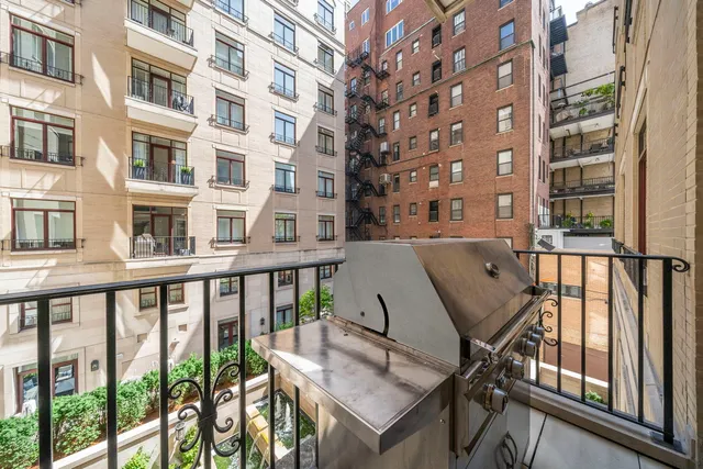 a view of a balcony with chairs