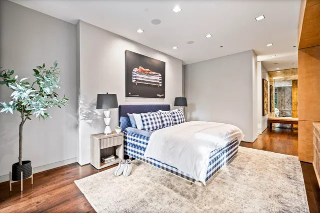 a living room with furniture and a lamp