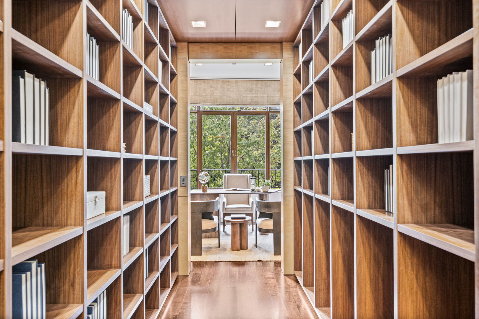 65 East Goethe Street, Unit 3W Chicago, IL 60610 - Photo 29 of 43 a room with lots of wooden furniture and a book shelf