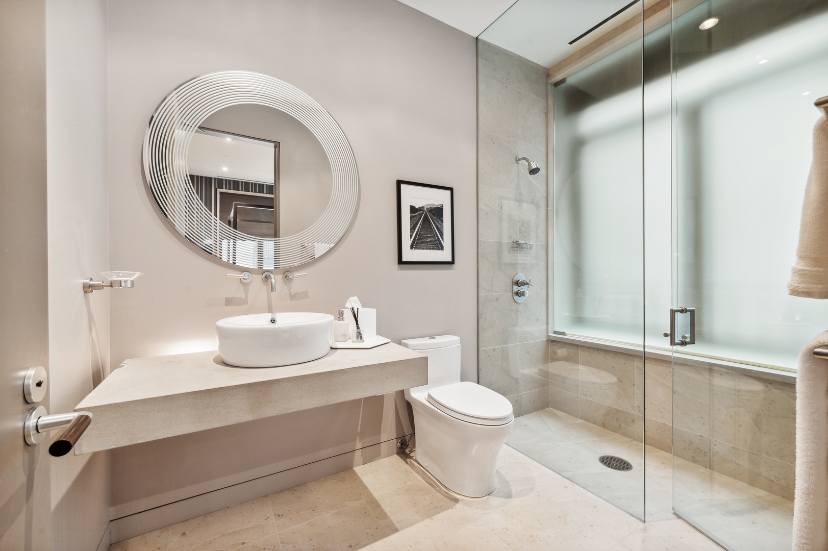 65 East Goethe Street, Unit 3W Chicago, IL 60610 - Photo 37 of 43 a bathroom with a toilet a sink and mirror