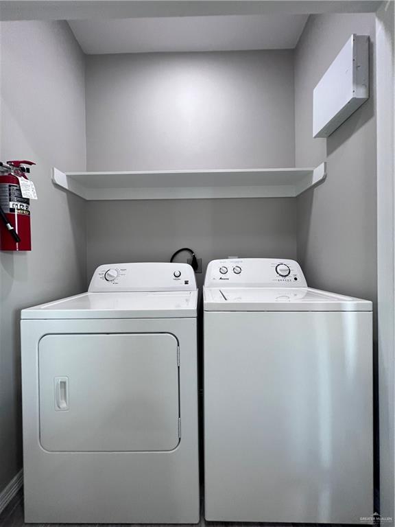 1812 Red Bud Drive, Unit 1 Weslaco, TX 78596 - Photo 23 of 25 a utility room with dryer and washer