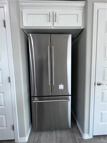 a view of a refrigerator in kitchen