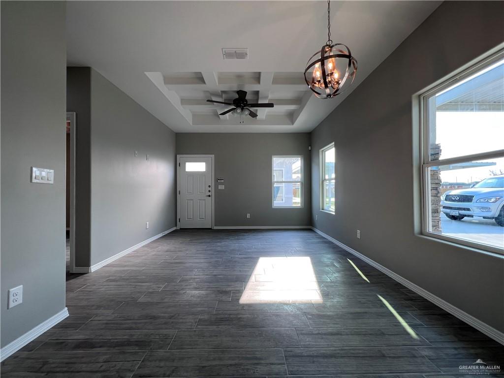 1812 Red Bud Drive, Unit 1 Weslaco, TX 78596 - Photo 9 of 25 a view of an empty room with window and wooden floor