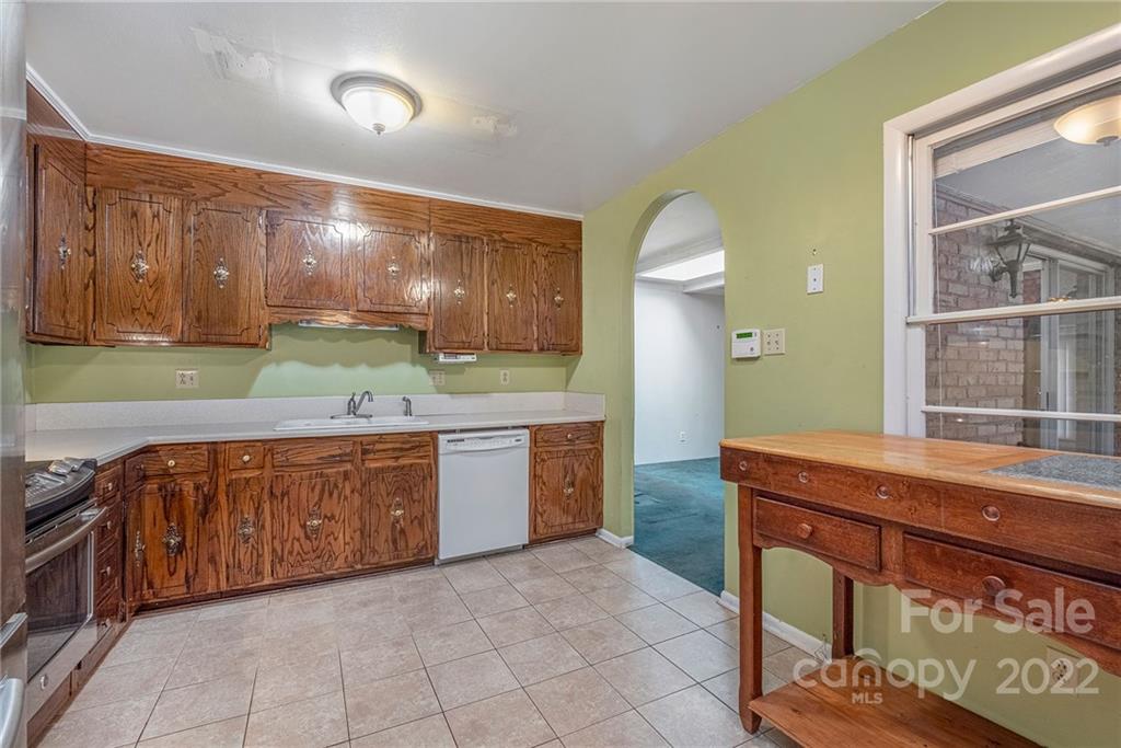 1446 McIlroy Road, Unit 8 Charlotte, NC 28212 - Photo 12 of 30 a kitchen with a sink and cabinets
