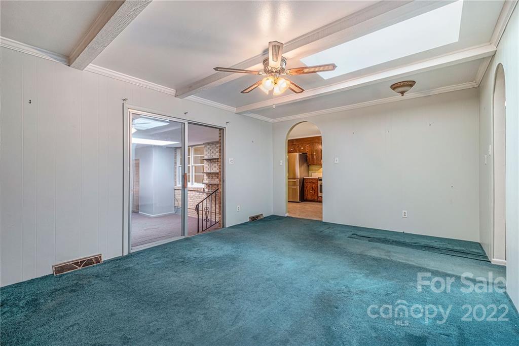 1446 McIlroy Road, Unit 8 Charlotte, NC 28212 - Photo 17 of 30 an empty room with closet and a ceiling fan