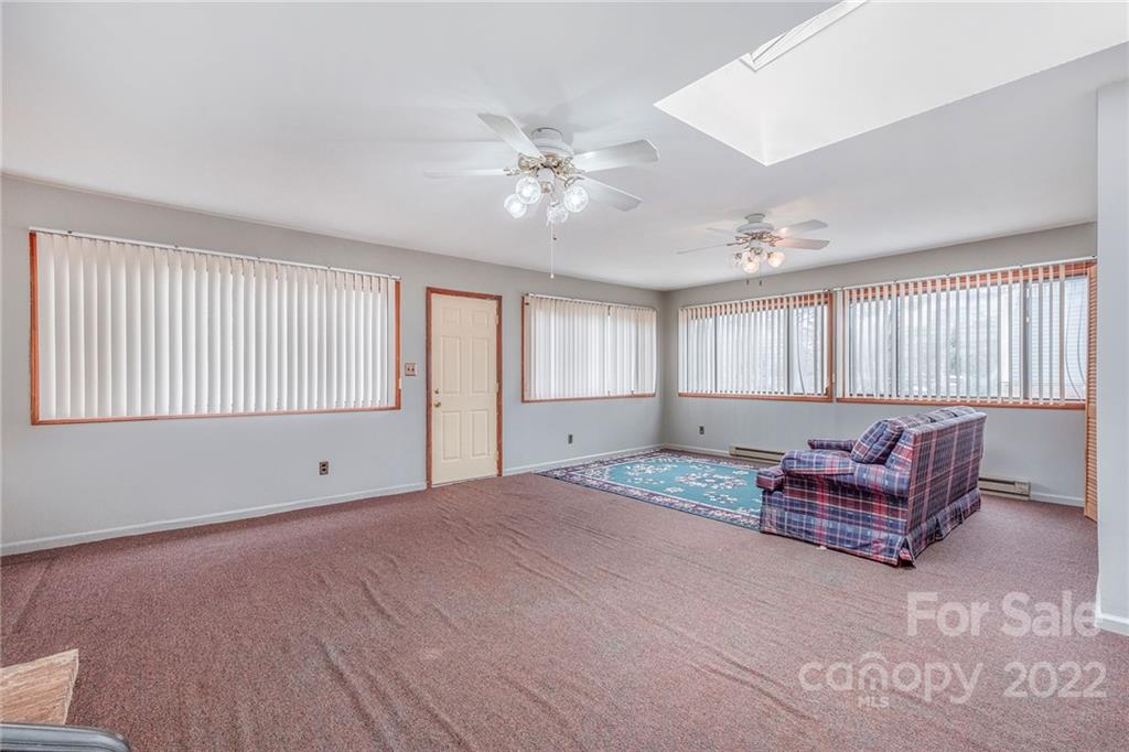 1446 McIlroy Road, Unit 8 Charlotte, NC 28212 - Photo 18 of 30 a living room with furniture and a ceiling fan