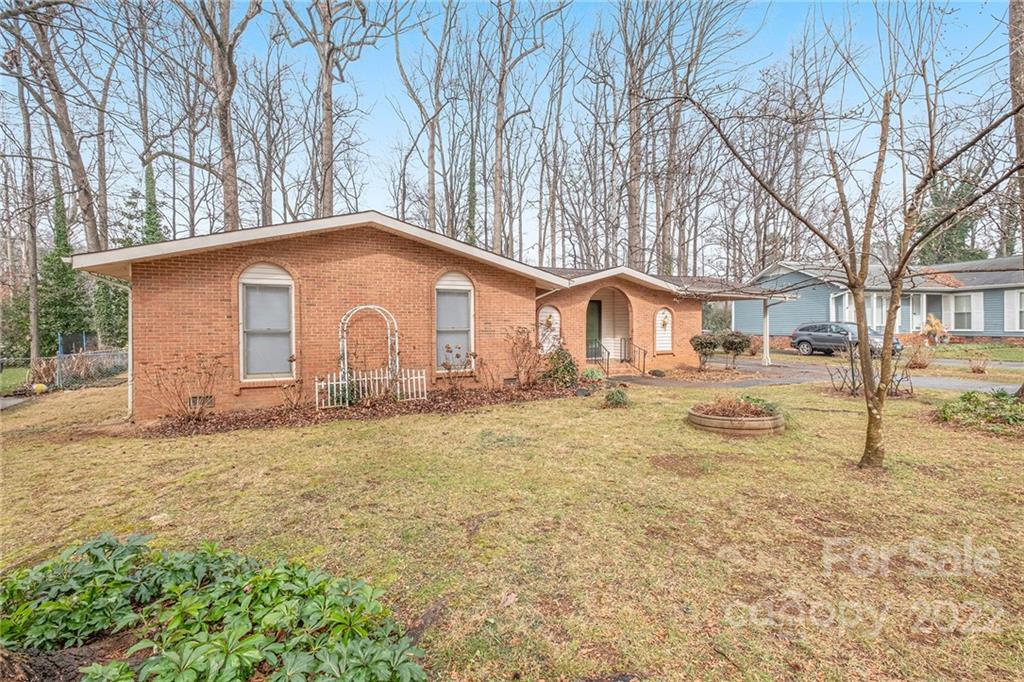 1446 McIlroy Road, Unit 8 Charlotte, NC 28212 - Photo 2 of 30 a front view of a house with a yard