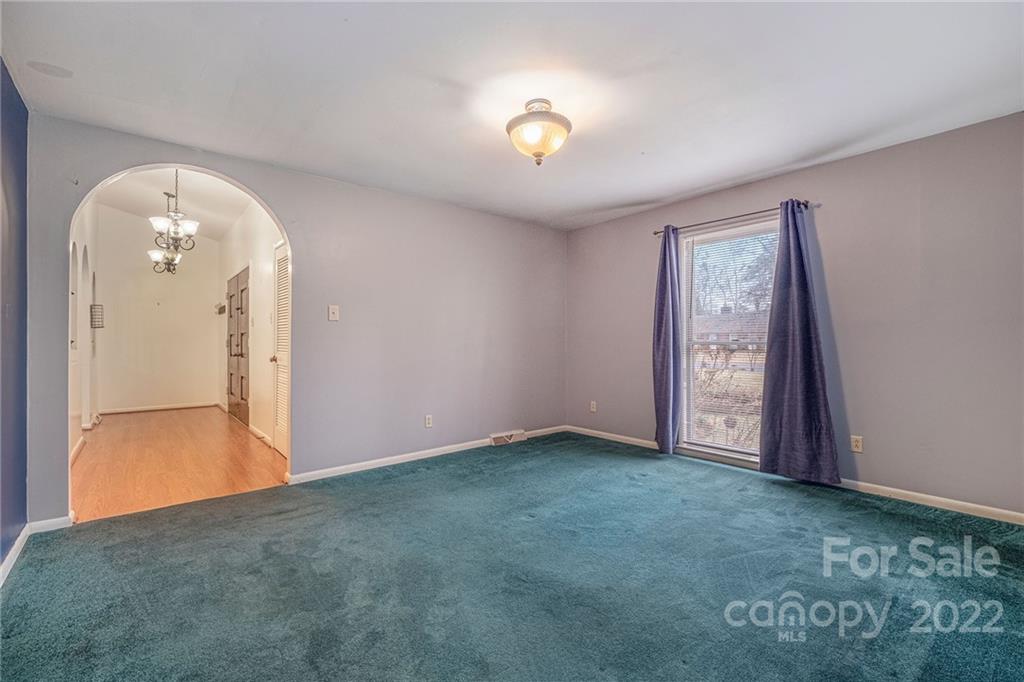 1446 McIlroy Road, Unit 8 Charlotte, NC 28212 - Photo 26 of 30 an empty room with closet and mirror